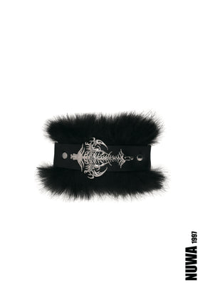 A black faux-fur choker collar featuring a wide black strap with a silver-toned gothic skeleton keyhole buckle, displayed on a clean white background with a NUWA 1997 brand mark in the bottom right corner.