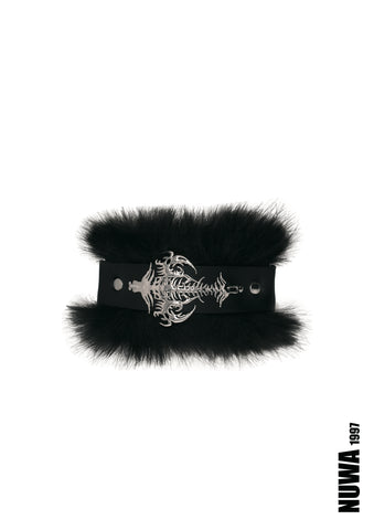 A black faux-fur choker collar featuring a wide black strap with a silver-toned gothic skeleton keyhole buckle, displayed on a clean white background with a NUWA 1997 brand mark in the bottom right corner.