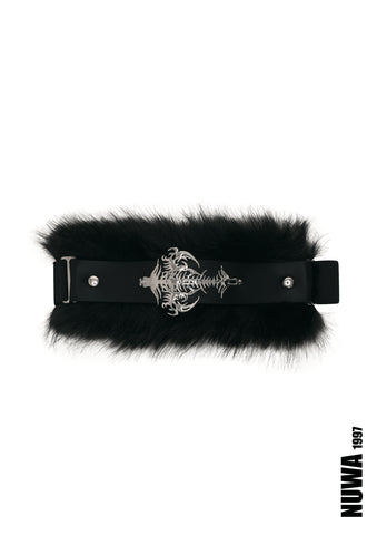 A black faux-fur belt with a black leather strap and a prominent silver-toned metal buckle featuring a skull and crossbones design, shown against a plain white background.